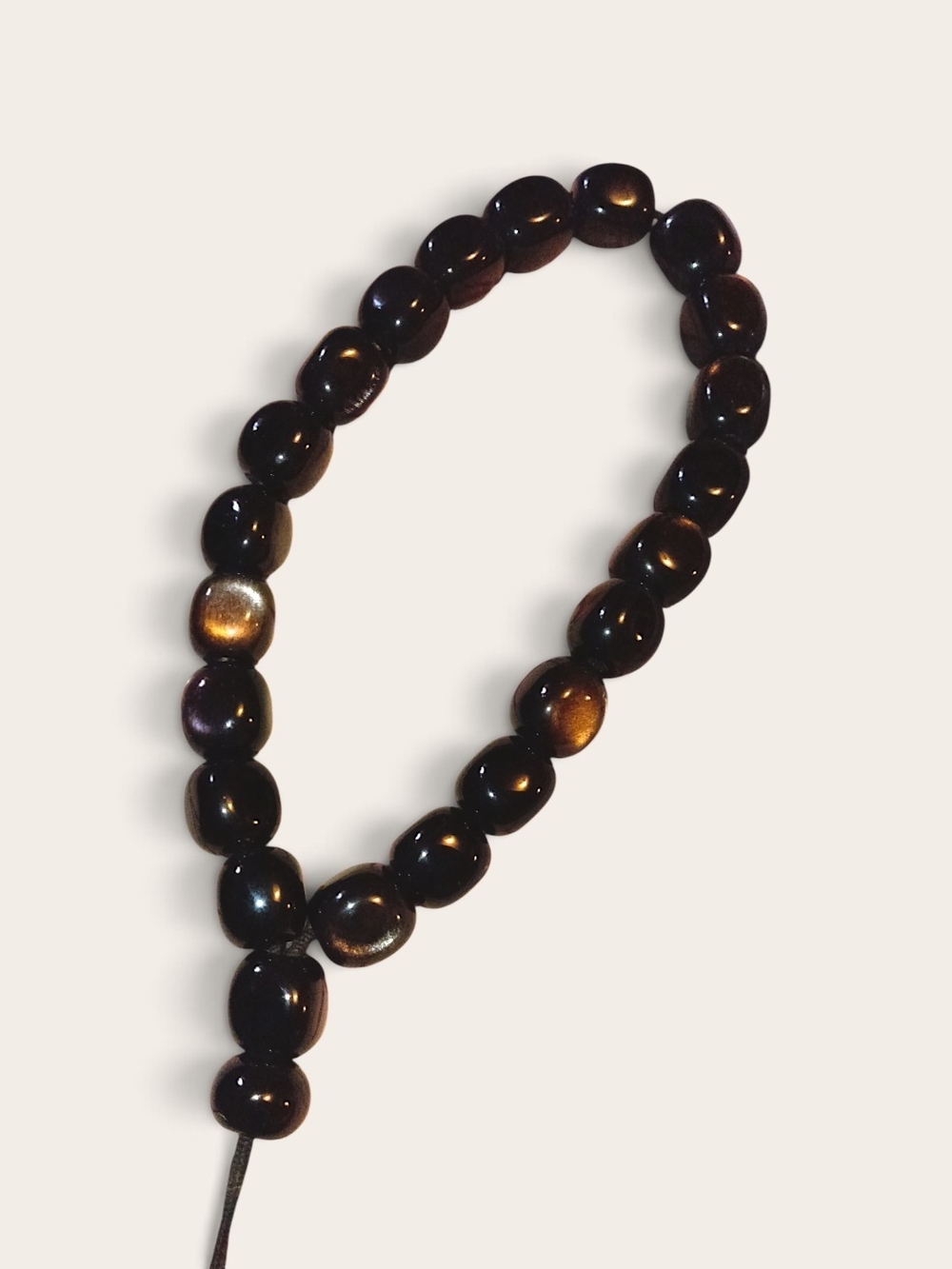 Polished strand of gold sheen obsidian prayer beads w/ chatoyant optical shimmer